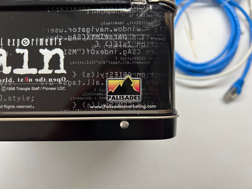 The underside of the Lain lunch box, showing the "www.Palisadesmarketing.com" URL underneath the Palisades logo.